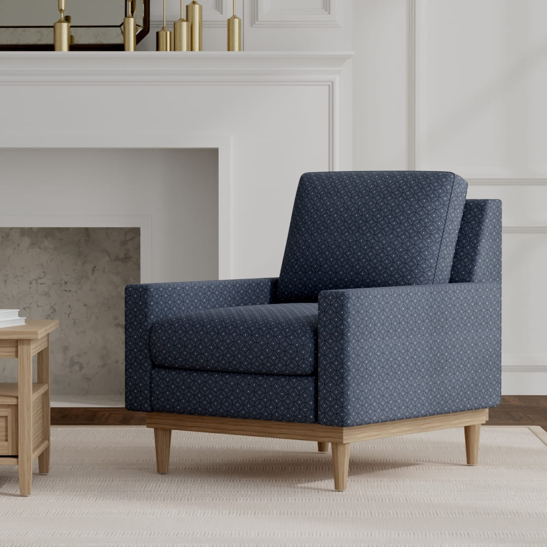 Elowen Navy upholstered on a mid century modern chair