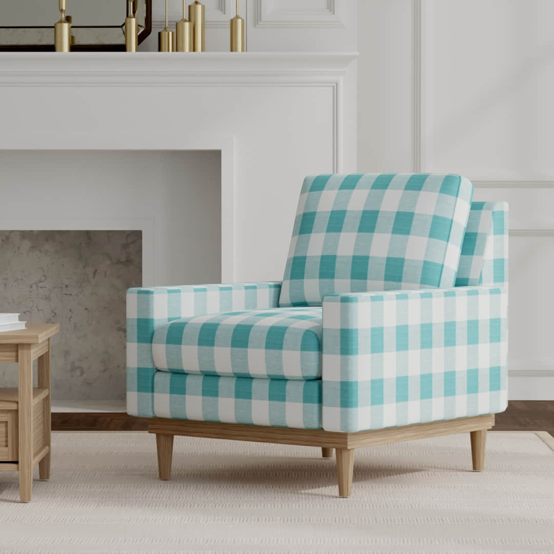 Jaelyn Ocean upholstered on a mid century modern chair